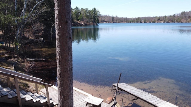 65485 Millicent Point Dr, Iron River, WI 54847 - water view featuring a boat dock and a heavily wooded area