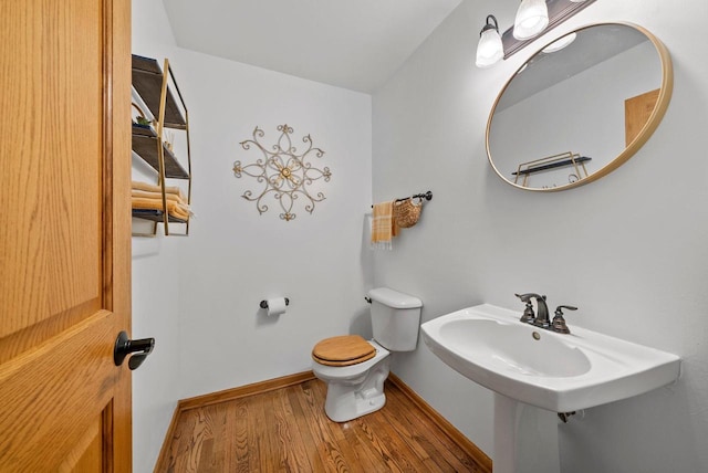 1755 Laura Ln, Port Washington, WI 53074 - bathroom with wood finished floors, toilet, and baseboards