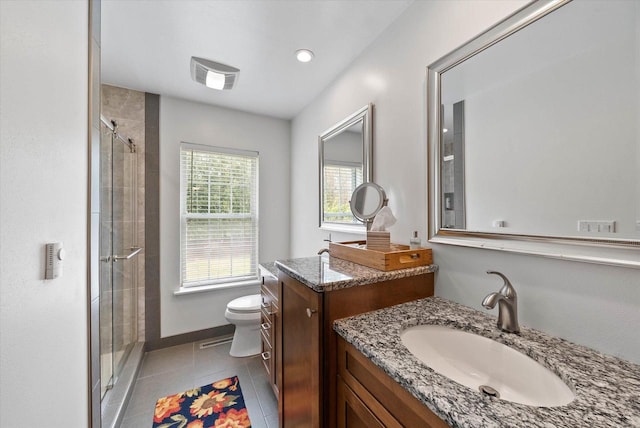 1755 Laura Ln, Port Washington, WI 53074 - bathroom with a stall shower, toilet, two vanities, and tile patterned flooring
