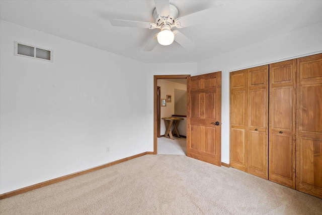 1755 Laura Ln, Port Washington, WI 53074 - unfurnished bedroom with carpet floors, baseboards, a closet, and a ceiling fan