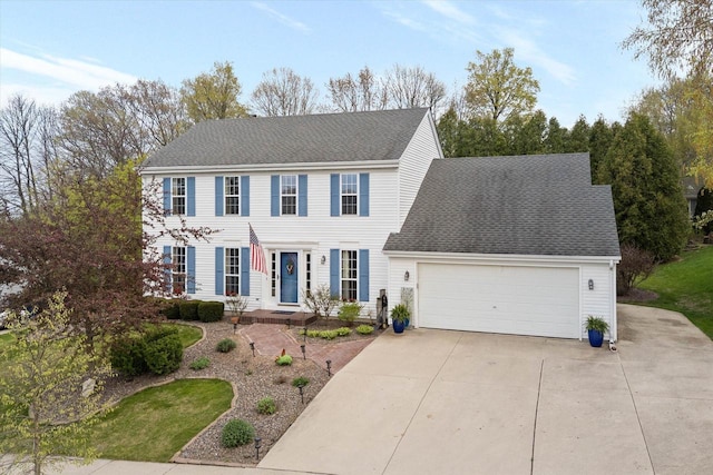 1755 Laura Ln, Port Washington, WI 53074 - colonial home with driveway, a garage, and roof with shingles