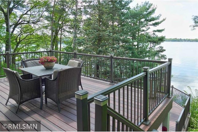 802 Flos Ct, Amery, WI 54001 - wooden terrace featuring a water view and outdoor dining area