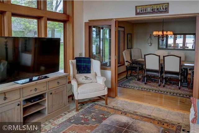 802 Flos Ct, Amery, WI 54001 - sitting room featuring a chandelier, plenty of natural light, and tile patterned flooring
