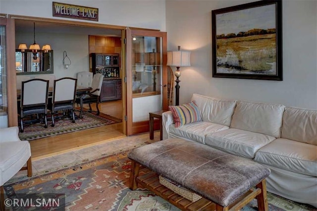 802 Flos Ct, Amery, WI 54001 - tiled living area featuring a chandelier