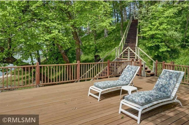 802 Flos Ct, Amery, WI 54001 - wooden terrace with stairs and view of wooded area