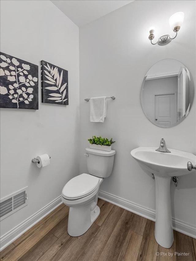 LT45 Lilac Ln, Delavan, WI 53115 - bathroom featuring wood finished floors, toilet, and baseboards