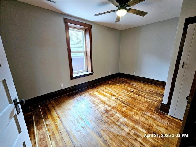 23716 Washington St # 1/ # 2, Independence, WI 54747 - spare room with hardwood / wood-style flooring, a ceiling fan, and baseboards