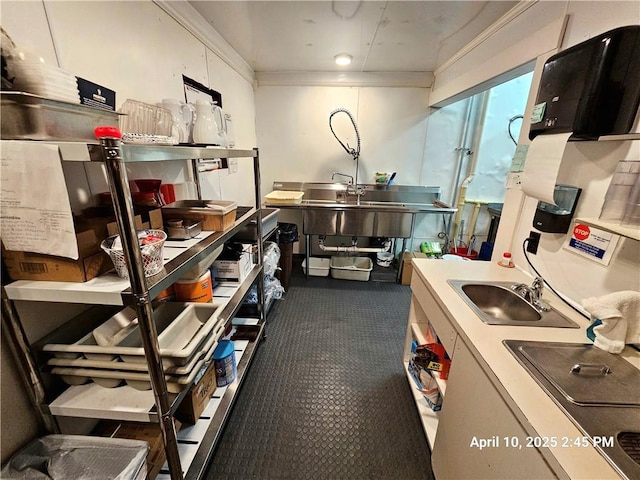 23716 Washington St # 1/ # 2, Independence, WI 54747 - kitchen with a sink, carpet flooring, and crown molding