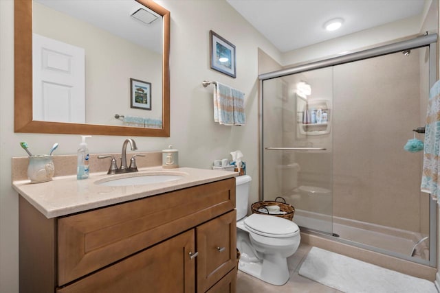 131 Lance Dr Unit 14, Twin Lakes, WI 53181 - full bathroom featuring toilet, a stall shower, vanity, and tile patterned floors