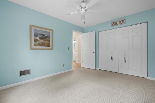 131 Lance Dr Unit 14, Twin Lakes, WI 53181 - unfurnished bedroom featuring baseboards, carpet, a closet, and ceiling fan