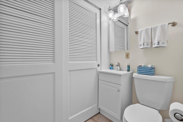 131 Lance Dr Unit 14, Twin Lakes, WI 53181 - bathroom with toilet, vanity, and tile patterned floors