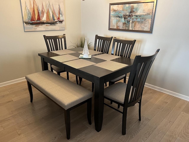131 Lance Dr Unit 14, Twin Lakes, WI 53181 - dining space with baseboards and light wood finished floors