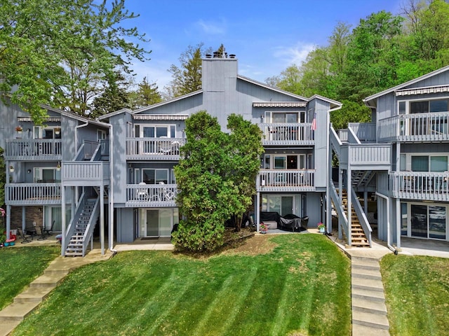 131 Lance Dr Unit 14, Twin Lakes, WI 53181 - view of building exterior with stairway
