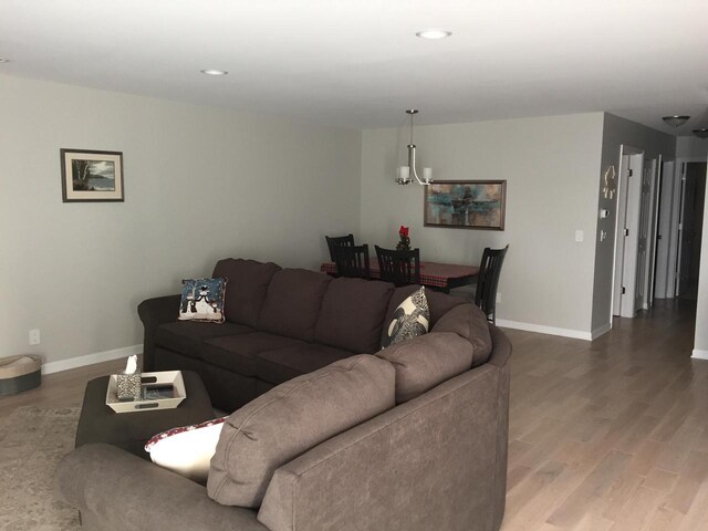 131 Lance Dr Unit 14, Twin Lakes, WI 53181 - living area featuring wood finished floors, baseboards, and recessed lighting