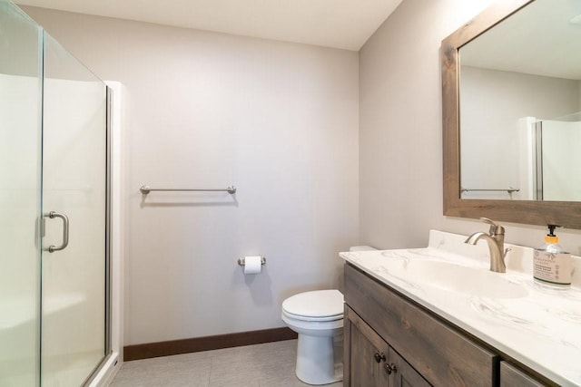 1996 Tucker Trl, Eau Claire, WI 54703 - bathroom with a shower stall, baseboards, vanity, and toilet