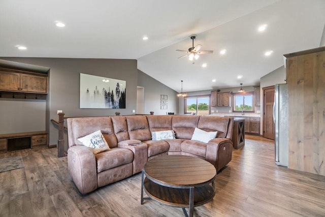 1996 Tucker Trl, Eau Claire, WI 54703 - living room with vaulted ceiling, a ceiling fan, wood finished floors, and recessed lighting