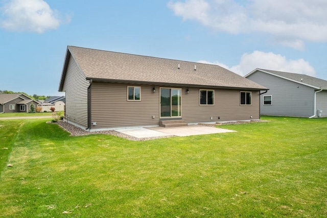 1996 Tucker Trl, Eau Claire, WI 54703 - rear view of house featuring a patio, a lawn, entry steps, and a shingled roof