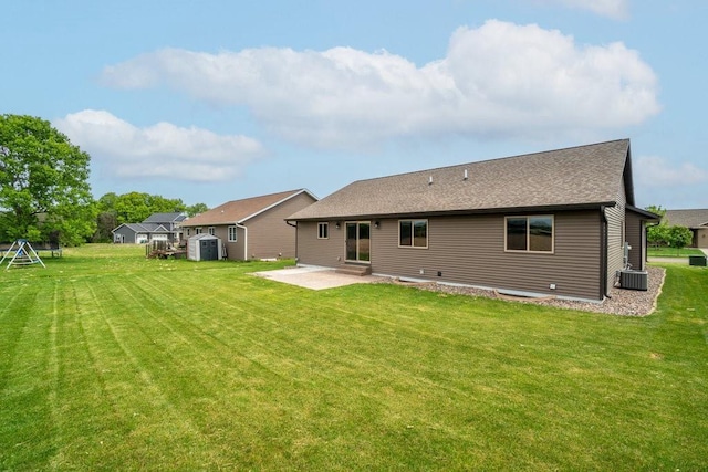 1996 Tucker Trl, Eau Claire, WI 54703 - back of property with a patio, a lawn, cooling unit, and a shingled roof