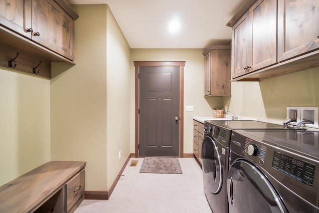 1996 Tucker Trl, Eau Claire, WI 54703 - laundry room featuring cabinet space, washer and dryer, and baseboards