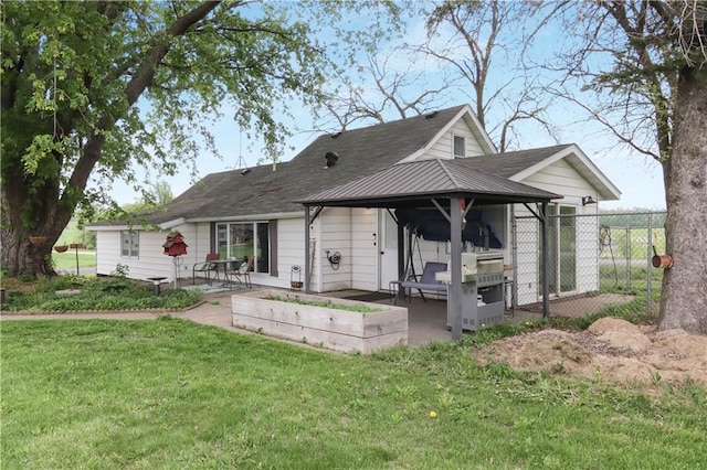 W4505 890th Ave, Baldwin, WI 54002 - rear view of property with a patio area and a vegetable garden