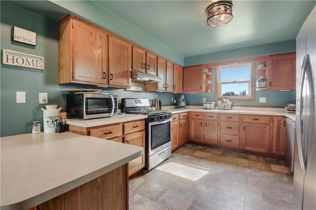 W4505 890th Ave, Baldwin, WI 54002 - kitchen featuring stainless steel appliances, under cabinet range hood, open shelves, light countertops, and stone finish floors