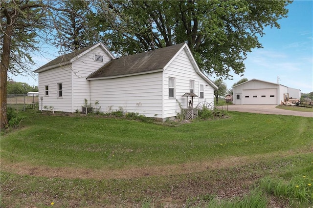 W4505 890th Ave, Baldwin, WI 54002 - view of home's exterior featuring a garage, an outbuilding, and a lawn