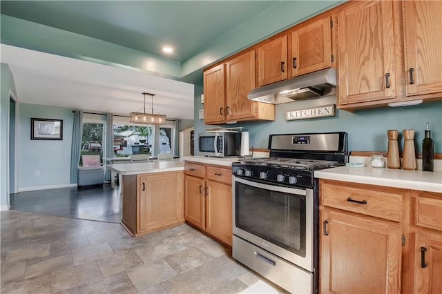 W4505 890th Ave, Baldwin, WI 54002 - kitchen featuring appliances with stainless steel finishes, under cabinet range hood, a peninsula, light countertops, and baseboards