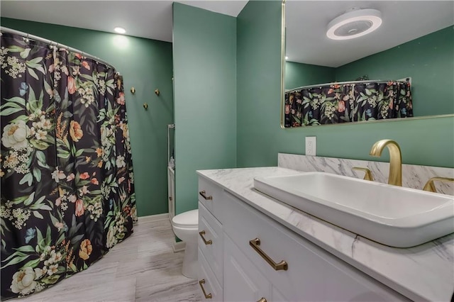W4505 890th Ave, Baldwin, WI 54002 - full bathroom featuring vanity, toilet, and marble finish floors