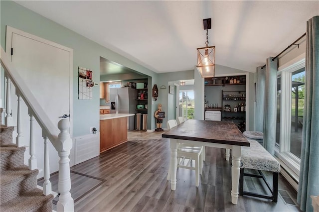 W4505 890th Ave, Baldwin, WI 54002 - kitchen with vaulted ceiling, wood finished floors, stainless steel fridge with ice dispenser, hanging light fixtures, and light countertops
