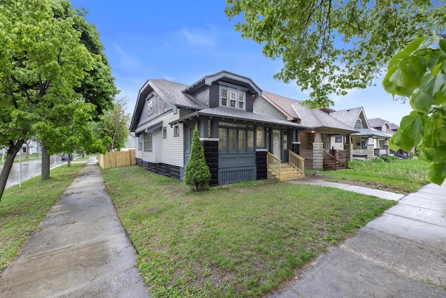 2976 N 40th St, Milwaukee, WI 53210 - view of front of house with a porch and roof with shingles