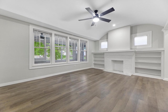2976 N 40th St, Milwaukee, WI 53210 - unfurnished living room with a brick fireplace, vaulted ceiling, ceiling fan, wood finished floors, and baseboards