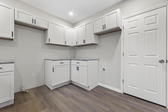 2976 N 40th St, Milwaukee, WI 53210 - kitchen featuring dark wood-type flooring, white cabinets, light stone counters, and recessed lighting