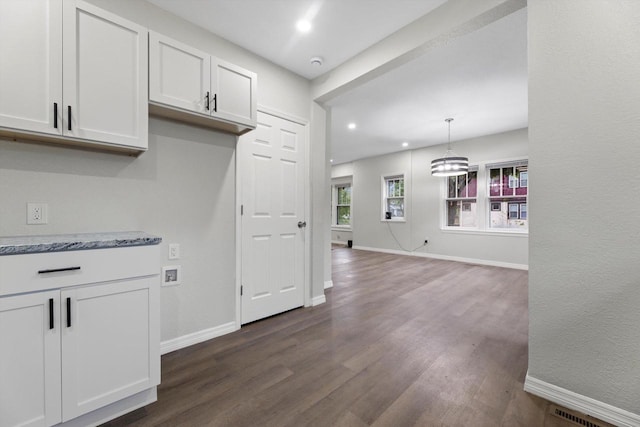2976 N 40th St, Milwaukee, WI 53210 - kitchen featuring dark wood finished floors, white cabinetry, baseboards, recessed lighting, and light stone countertops