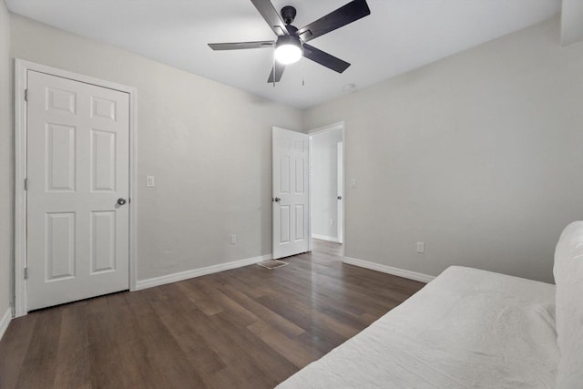 2976 N 40th St, Milwaukee, WI 53210 - unfurnished bedroom with wood finished floors, baseboards, and ceiling fan