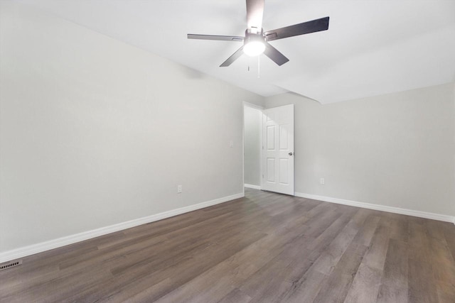 2976 N 40th St, Milwaukee, WI 53210 - empty room with baseboards, dark wood-style flooring, and a ceiling fan