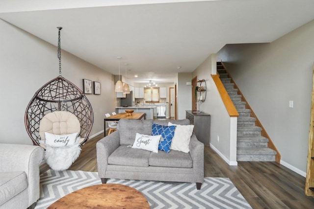 874 Xanadu Rd, Wisconsin Dells, WI 53965 - living room featuring dark wood-style floors, stairs, and baseboards