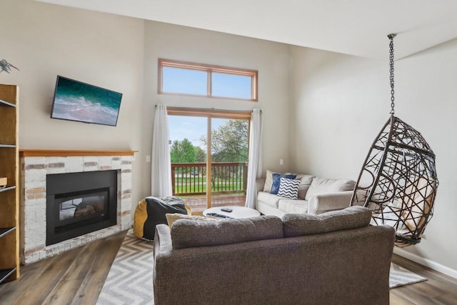 874 Xanadu Rd, Wisconsin Dells, WI 53965 - living area with wood finished floors, a fireplace, and baseboards