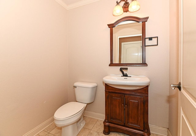 8940 Marie Ct, Mount Pleasant, WI 53406 - half bathroom featuring toilet, vanity, tile patterned flooring, baseboards, and ornamental molding