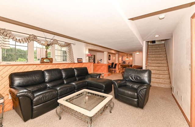 8940 Marie Ct, Mount Pleasant, WI 53406 - carpeted living area with stairs, bar, and a textured ceiling
