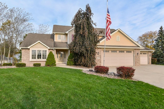 8940 Marie Ct, Mount Pleasant, WI 53406 - view of front of property featuring driveway, brick siding, a garage, a front lawn, and a shingled roof