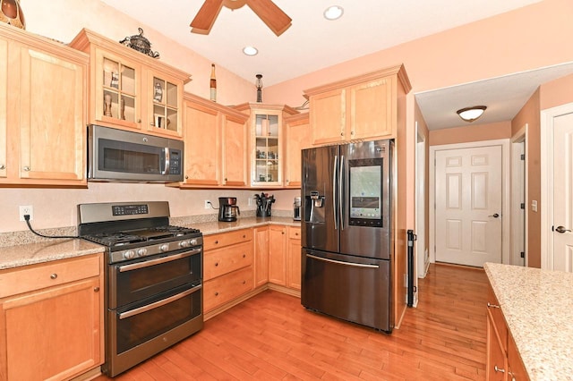 8940 Marie Ct, Mount Pleasant, WI 53406 - kitchen with stainless steel appliances, light brown cabinetry, light wood finished floors, a ceiling fan, and recessed lighting