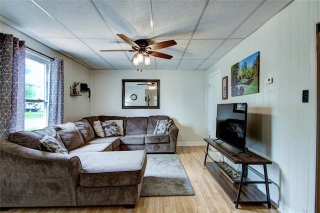 320 E Linden St, Chippewa Falls, WI 54729 - living room with a ceiling fan, light wood finished floors, a drop ceiling, and baseboards