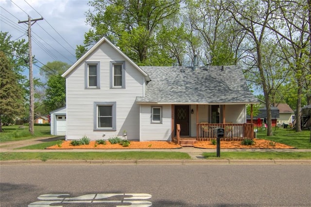 320 E Linden St, Chippewa Falls, WI 54729 - traditional-style house featuring a porch, a shingled roof, and a garage