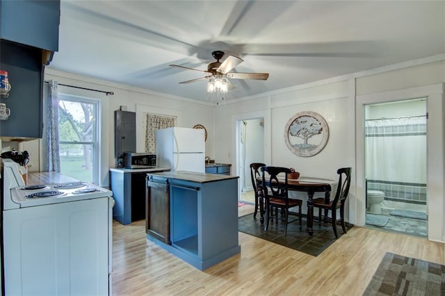 320 E Linden St, Chippewa Falls, WI 54729 - kitchen featuring white appliances, a center island, ceiling fan, light wood finished floors, and blue cabinetry