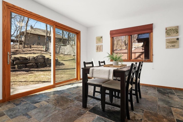 6208 Indian Mound Dr, Mcfarland, WI 53558 - dining space featuring stone tile floors and baseboards