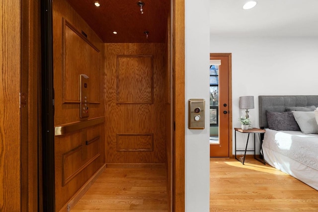 6208 Indian Mound Dr, Mcfarland, WI 53558 - corridor with elevator, light wood-style flooring, and recessed lighting