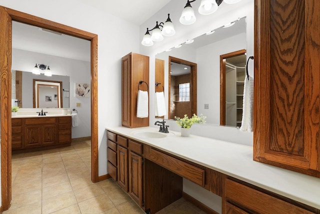 6208 Indian Mound Dr, Mcfarland, WI 53558 - bathroom with vanity, tile patterned floors, and baseboards