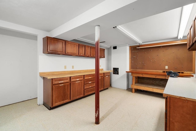 6208 Indian Mound Dr, Mcfarland, WI 53558 - kitchen with brown cabinets, light flooring, and light countertops