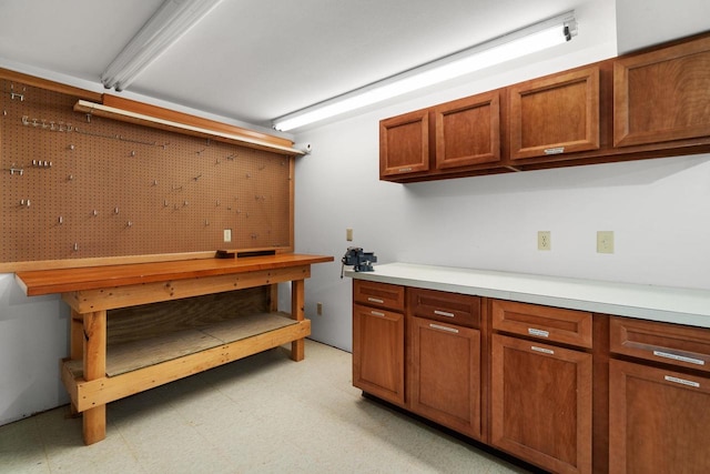 6208 Indian Mound Dr, Mcfarland, WI 53558 - basement featuring a workshop area and light floors