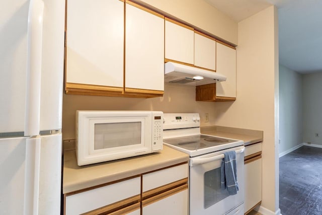 956 Rockefeller Ln, Madison, WI 53704 - kitchen featuring under cabinet range hood, white appliances, light countertops, white cabinetry, and baseboards